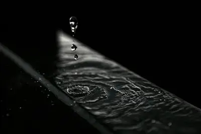 Water droplets on a black surface
